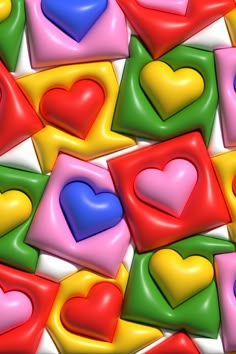 many different colored hearts on a white background