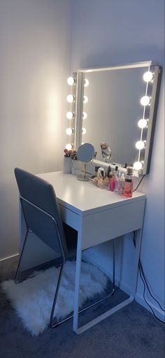 a white vanity with lights and a chair in front of it on carpeted floor