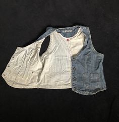 "Vintage Women's Retro Denim Vest/ Blue Jeans tan / Metal buttons with label: BIAGGINI/ Biaggini/ Bolero vest/ Pockets. Seams inside with flower pattern. Condition: good. Measurements: Length: 19.7\" / 50 cm Pit to pit: 20.1\" / 51 cm Labeled size: EU 44 (plus size XL) Material: 99% cotton, 1% elastane Please check measurements to insure a proper fit. Remember to allow yourself some extra room for movement. You can compare these with something from your closet that fits you well. #JZ13" Casual Denim Blue Vest With Buttons, Cotton Vest With Medium Wash And Buttons, Casual Medium Wash Vest With Buttons, Medium Wash Denim Vest With Buttons, Cotton Denim Vest With Pockets, Denim Blue Vest With Buttons, Sleeveless Vest With Pockets In Medium Wash, Medium Wash Cotton Vest With Buttons, Casual Cotton Vest With Snap Buttons