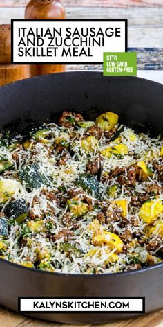 an italian sausage skillet meal in a pan with cheese and vegetables on the side