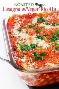 a casserole dish with cheese and parsley on top is ready to be eaten