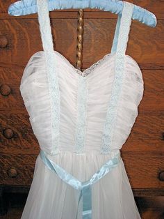 This has to be the most beautiful frothy, dreamy, romantic vintage nightgown we have seen in a long while! It is a snowy white with baby blue ribbon peeking under the lace inserts. The flattering draped bodice is  stunning! Totally pure glam! The gown is made by Cartlon in size bust 34, condition is wonderful-no problems and looks seldom worn, truly gift worthy. What a perfect honeymoon nightgown or just enjoy displaying it! A dreamy vintage nightgown to own! We combine shipping and ship internationally. 1950s Nightgown, Nightgown Romantic, Slip Nightgown, Perfect Honeymoon, Lingerie Vintage, Draped Bodice, Womens Lingerie, Vintage Nightgown, Fashion Themes