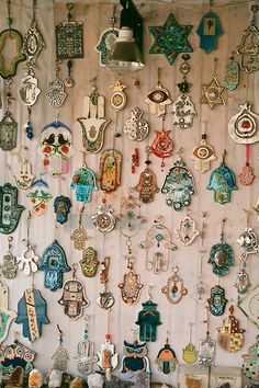 a wall covered in lots of different types of earrings