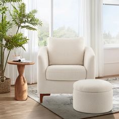 a living room with a white chair and ottoman