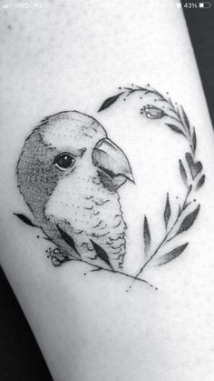 a black and white photo of a bird on the arm