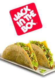 two tacos on a plate with the back in the box sticker above it