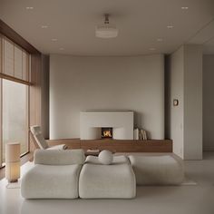 a modern living room with white furniture and large windows