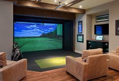 a living room filled with furniture and a flat screen tv mounted to the side of a wall