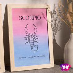 two framed posters with scorpio on them next to vases and flowers