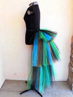 a black mannequin with multi colored tulle