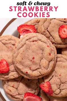 soft and chewy strawberry cookies on a white plate with strawberries in the middle