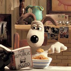 a cartoon dog eating cereal from a bowl in the shape of a puppy holding a book