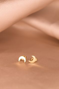 These moon studs are golden minimalist classics that are perfect for any ear stack! We love wearing the Luna studs on their own, or pairing them with our earrings, such as the Léna hoops or Tali hoops. -24K Gold Filled studs -Sold as a pair Minimalist Yellow Gold Earrings With Moon Charm, Gold Moon-shaped Earrings, Gold Moon Earrings Studs, Gold Hypoallergenic Moon-shaped Earrings, Ear Stack, Moon Studs, Gold Filled, Stud Earrings, Gold