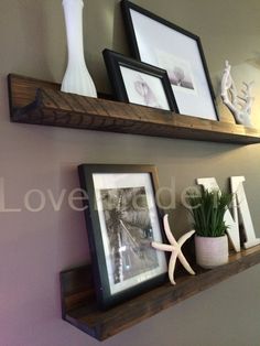 two wooden shelves with pictures on them, one shelf has a starfish and the other is