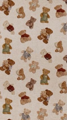 a group of teddy bears sitting on top of a white ground covered in small squares