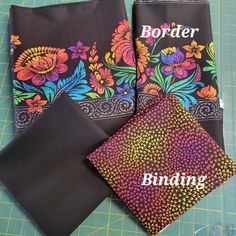 three black bandanas with colorful flowers on them and the words border written in white