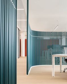 an office with blue and white striped walls