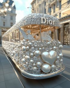 a train decorated with pearls and hearts on the tracks