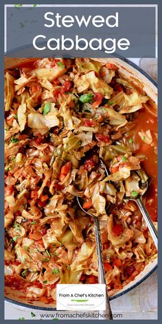 a large pot filled with stew and vegetables on top of a white tablecloth next to a