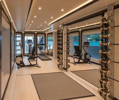 a gym with exercise equipment and mirrors