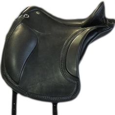 a close up of a black saddle on a white background