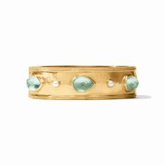 Luxuriously gilded wide bangle featuring pear shape gemstones and freshwater pearl. Luxury Hinged Cuff Bangle, Luxury Oyster Bangle Cuff Bracelet, Modernist Cuff Bangle Bracelet With Oyster Design, Luxury Blue Gemstone Bangle, Luxury Gold-tone Statement Bangle, Blue In Green, Julie Vos, Photo Lighting, Gold Bangle Bracelet