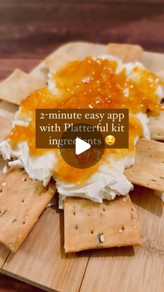 an appetizer with crackers and cheese on it