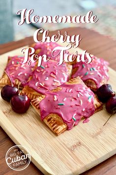 homemade cherry pop tarts with sprinkles and cherries on a cutting board