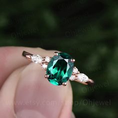 "This is a 1.3 carat Lab treated emerald engagement ring in solid gold,about 6x8mm oval cut,forever classic quality. The accent stones are round 1.5mm and marquise 2x4mm moissanites, It can be made in any ring size. However please contact me to custom make it to a special big or small size. It can be made in white gold,rose gold or yellow gold with 14k or 18k. However for some people who are nickel allergic,I can also make it to 925 sterling silver to make you can wear it. The ring is handmade,v Emerald Ring Oval, Oval Cut Emerald Engagement Ring, Emerald Jewelry With Marquise Cut Center Stone, Oval Emerald Rose Gold Jewelry, Marquise Cut Emerald Jewelry With Prong Setting, Emerald Jewelry Marquise Cut For May Birthstone, Marquise Cut Emerald Jewelry For May Birthstone, Oval Green Moissanite Jewelry, Emerald Oval Engagement Ring