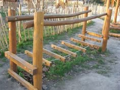 a wooden fence made out of sticks and logs