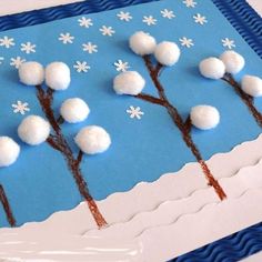 this is an image of a winter scene made out of paper with snow on the branches