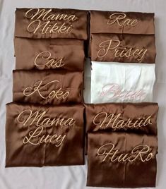 four brown and white pillow cases with names on them