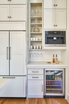 a refrigerator freezer sitting inside of a kitchen