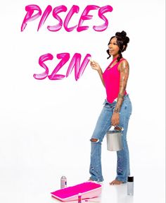 a woman in pink shirt and jeans holding a paint can with words on it that say pisces sin