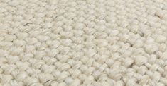 close up view of the texture of a white carpet