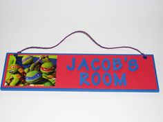 a sign that says,'jacob's room'with teenage mutants on it