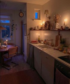 a kitchen filled with lots of counter top space next to a dining room table and chairs