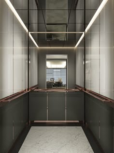 an empty room with glass partitions on the walls and doors to other rooms in it