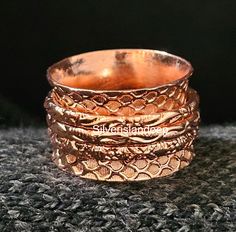 Pure Copper Ring, Solid Copper Ring, Meditation Ring, Wide Band Copper Spinner Ring, Handmade Women Ring, Spinner Ring, Wide Band Ring.  Pure Copper Spinner Ring Metal:  Pure Copper Ring  Handmade Item Style: Boho & hippie Best Gift For Loved One, Anniversary Gift, Birthday Gift, Engagement Gift, Wedding Gift, Gift For Sister, Gift For Wife, Gift For Mother, Occasional Gift. Using Spinner Rings For Stress Relief:- Handcraft Copper Jewelry Bold Copper Jewelry 100 % Pure Cooper Ring Copper Jewelry Handmade Adjustable Wide Band Stackable Rings, Handmade Wide Band Stackable Rings As Gift, Copper Rings Women, Unique Handmade Wide Band Round Ring, Bohemian Copper Rings As Gifts, Bohemian Copper Rings For Gifts, Artisan Copper Ring Jewelry, Spiritual Hand Forged Copper Rings, Prayer Ring