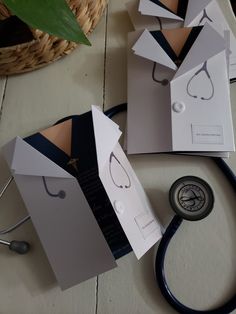 several pieces of paper with stethoscope attached to them on top of a table