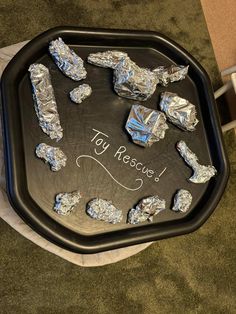 tin foil is on top of a black tray