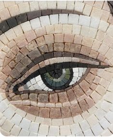 an eye made out of different colored bricks