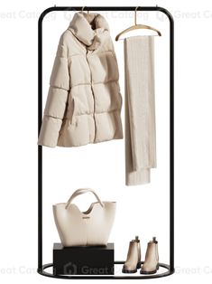 a white coat and handbag are hanging on a black garment rack with two coats