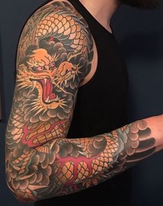 a man with a dragon tattoo on his arm