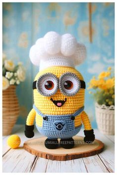 a crocheted minion with glasses and a chef's hat on it