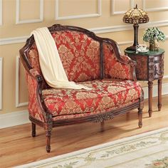 an ornately decorated living room with red and gold furniture