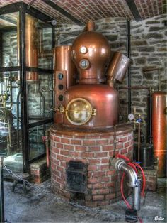 an old fashioned steam boiler in a brick building