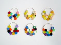 four pairs of earrings made out of buttons