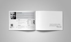 an open brochure is displayed on a gray background with black and white images