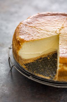 a cheesecake with one slice missing from it